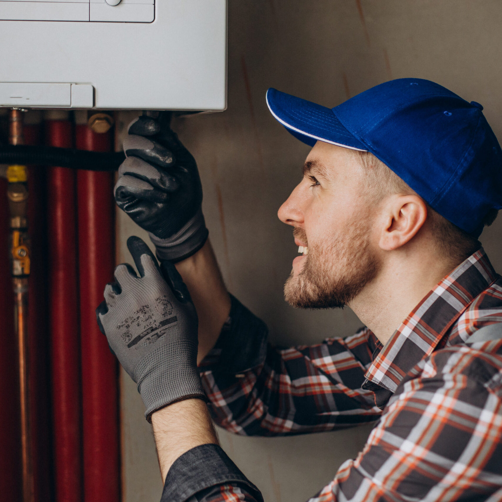 Service man adjusting house heating system